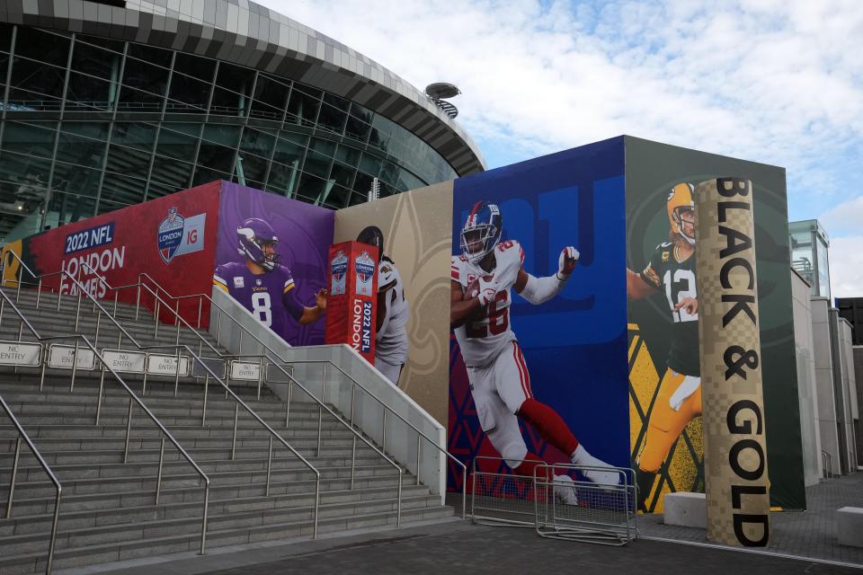 Images of Minnesota Vikings quarterback Kirk Cousins (8), New Orleans Saints running back Alvin Kamara (41), New York Giants running back Saquon Barkley (26) and Green Bay Packers quarterback Aaron Rodgers (12) at Tottenham Hotspur Stadium.