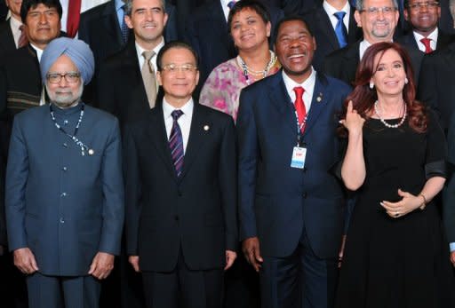 L to R: India's Prime Minister Manmohan Singh, China's Premier of the State Council Wen Jiabao, Benin's President Boni Yayi and Argentina's President Cristina Fernandez de Kirchner pose during the UN Conference on Sustainable Development Rio+20 family photo, in Rio de Janeiro, Brazil