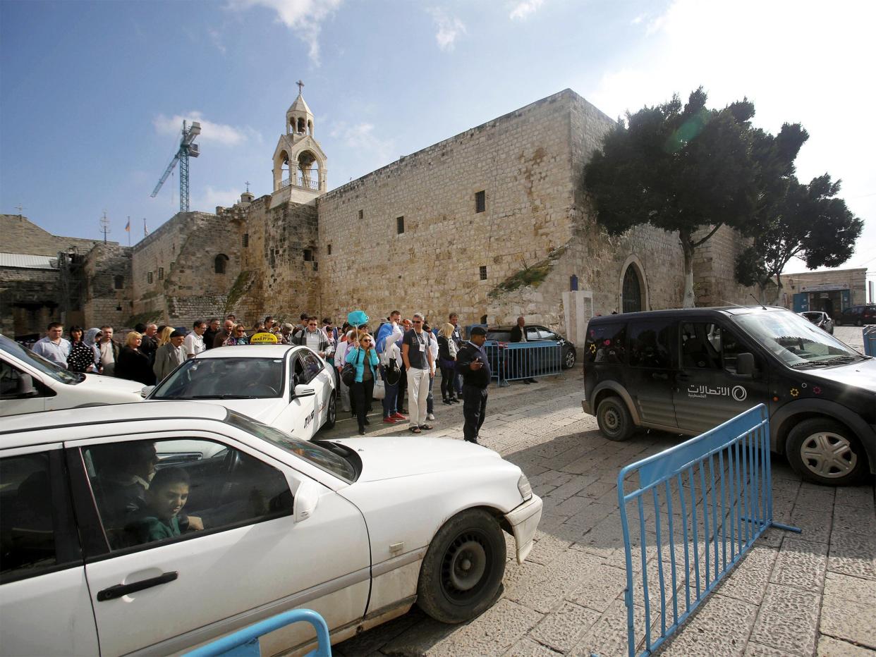 The Church of the Nativity in Manger Square, Bethlehem, where tourists and cars compete for space: AP