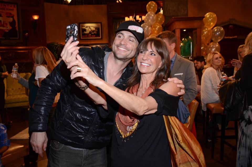 Jess Walton and Daniel Goddard pose for a selfie at "The Young And The Restless" 41st Anniversary, on Tuesday, March 25, 2014, in Los Angeles. (Photo by Tonya Wise/Invision/AP)