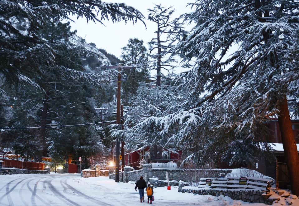 Snow blankets the town in the San Gabriel Mountains, in San Bernardino County along the border of Los Angeles County, on February 23 in Mount Baldy, California A major storm, carrying a rare blizzard warning for parts of Southern California, is expected to deliver heavy snowfall to the mountains with some snowfall expected to reach lower elevations in LA County. (Photo by Mario Tama/Getty Images) (Getty Images)