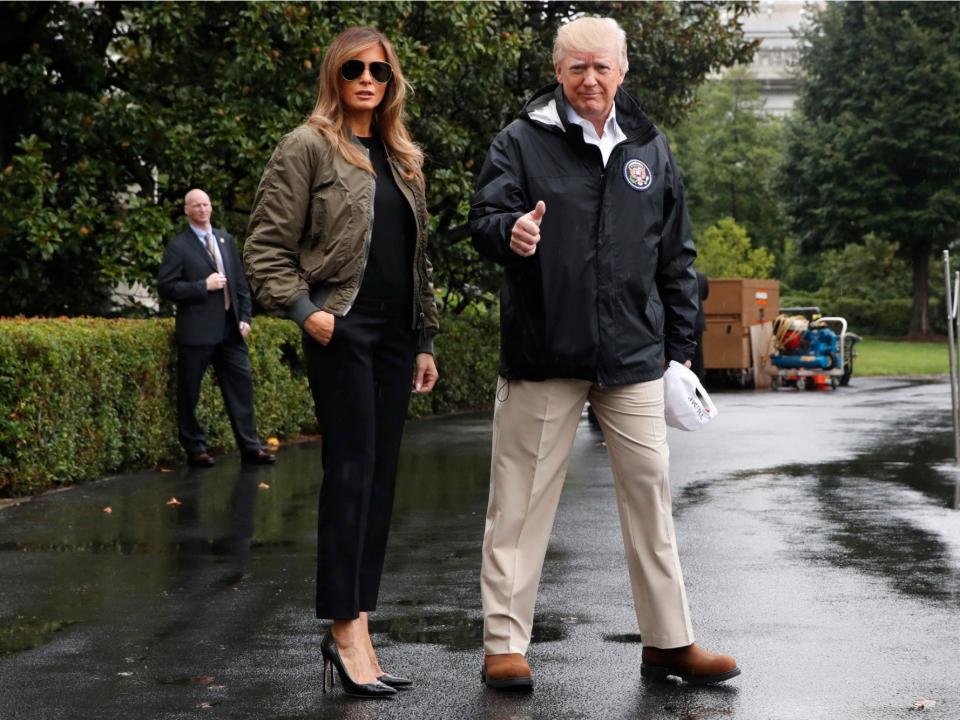 Donald Trump and Melania Trump walk to Marine One on their way to Texas, which was hit by Hurricane Harvey.