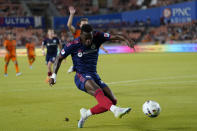 Chicago Fire's Jhon Duránm takes a shot on goal against the Houston Dynamo during the second half of an MLS soccer game Saturday, June 25, 2022, in Houston. (AP Photo/David J. Phillip)