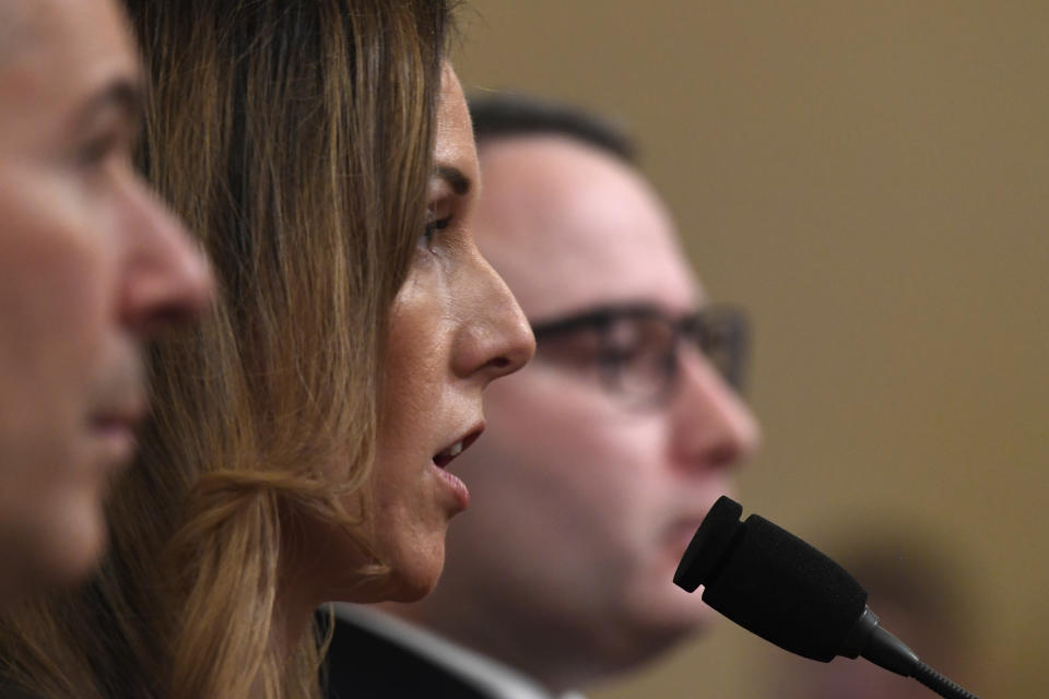 Jennifer Williams, an aide to Vice President Mike Pence, center, and National Security Council aide Lt. Col. Alexander Vindman, testify before the House Intelligence Committee on Capitol Hill in Washington, Tuesday, Nov. 19, 2019, during a public impeachment hearing of President Donald Trump's efforts to tie U.S. aid for Ukraine to investigations of his political opponents. (AP Photo/Susan Walsh)