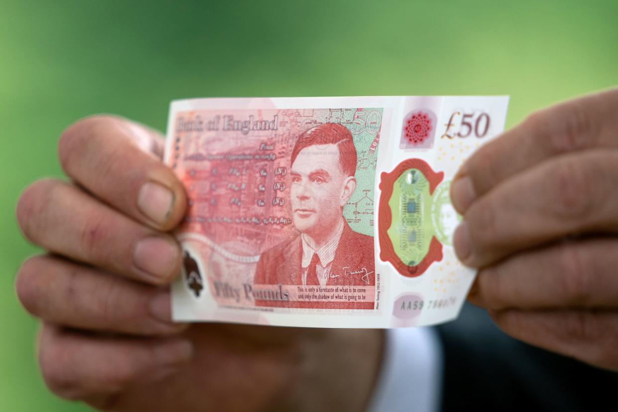 Bank of England Governor Andrew Bailey holds the new £50 note (REUTERS)