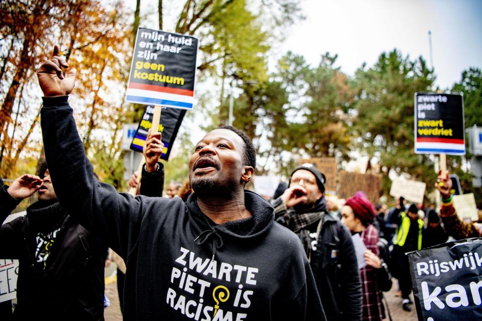 Activist Jerry Afriyie, leader of the Kick Out Zwarte Piet movement, demonstrating during the arrival of Sinterklaas in November 2019. (Getty Images)