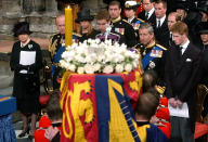 <p>The Queen and the rest of the Royal Family at the funeral of the Queen Mother in Westminster Abbey on 9 April 2002. (PA)</p> 