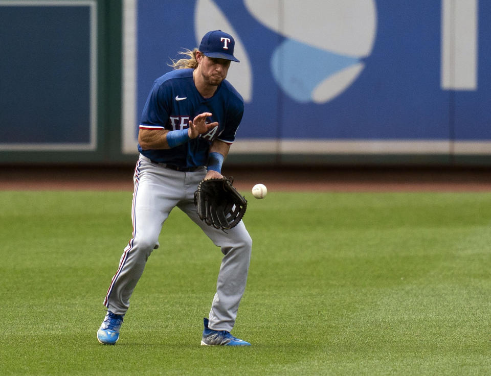 Texas Rangers left fielder Travis Jankowski catches a single during the first inning of a baseball game against the Washington Nationals, Saturday, July 8, 2023, in Washington. (AP Photo/Stephanie Scarbrough)