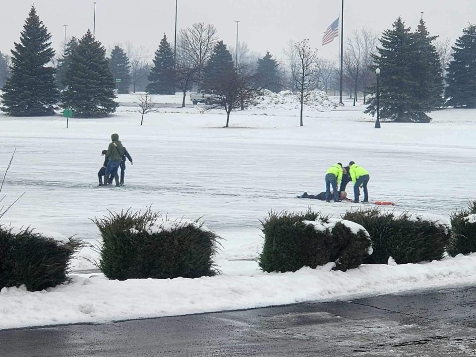 A 12-year-old boy was rescued after falling into an icy pond in Michigan on Tuesday.