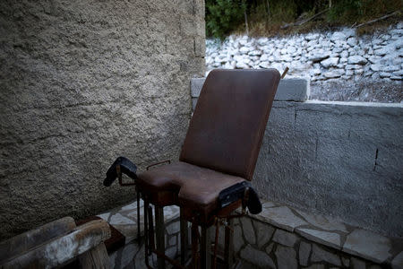 A disused gynaecologist chair is seen outside the disused Thymaina's medical centre, on the islet of Thymaina, Greece, May 11, 2017. REUTERS/Alkis Konstantinidis