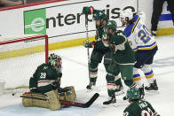 St. Louis Blues' Brandon Saad (20) scores a goal off Minnesota Wild goalie Marc-Andre Fleury (29) to tie the game in the second period of Game 5 of an NHL hockey Stanley Cup first-round playoff series, Tuesday, May 10, 2022, in St. Paul, Minn. (AP Photo/Jim Mone)