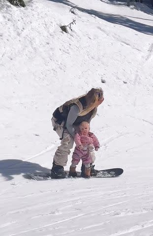 <p>Jamie Anderson/Instagram</p> Jamie Anderson and her daughter snowboarding