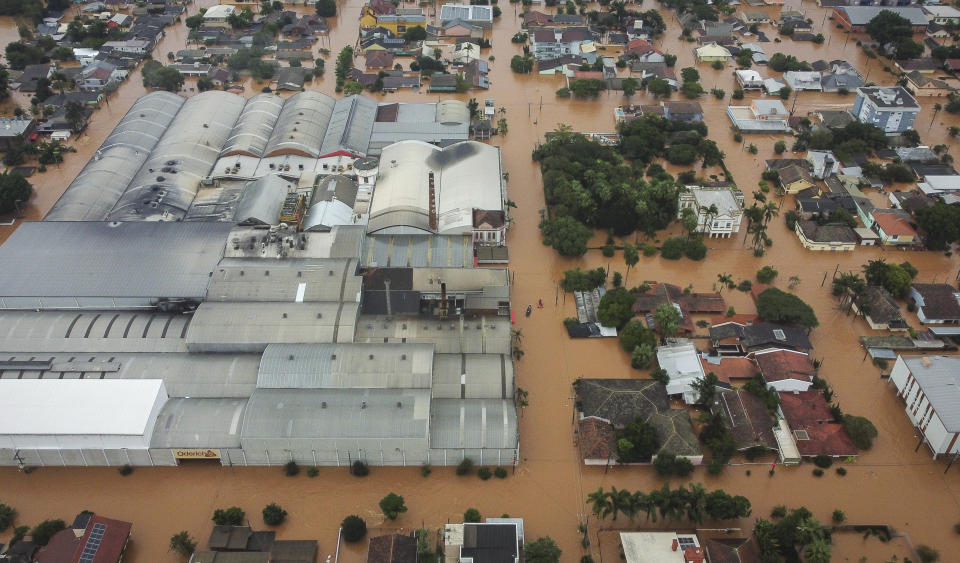 FILE - Streets are flooded after heavy rain in Sao Sebastiao do Cai, Rio Grande do Sul state, Brazil, May 2, 2024. In a world growing increasingly accustomed to wild weather swings, the last few days and weeks have seemingly taken those environmental extremes to a new level. (AP Photo/Carlos Macedo, File)