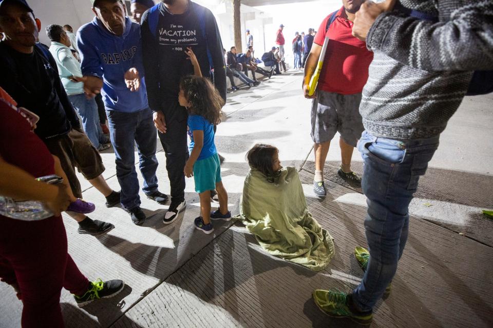 A Venezuelan migrants child sits on the ground after having arrived with her Venezuelan parents to Ciudad Juarez on Oct, 15, 2022. The migrant family was debating whether to cross into the U.S. after talking to expelled migrants.