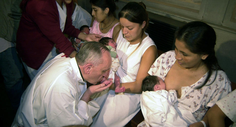 The then-archbishop of Buenos Aires, Jorge Bergoglio (who later became Pope Francis), performs a foot-bath ceremony in Buenos Aires in 2005, inches from a mother breastfeeding her infant. (Photo: Daniel Vides/AFP/Getty Images)