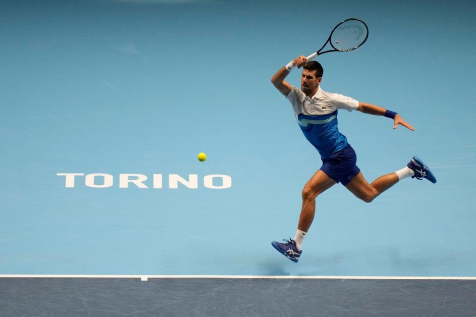 Novak Djokovic hits a running forehand (AP)