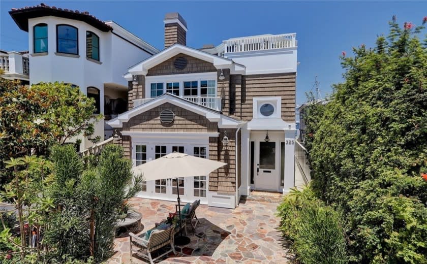 The three-story home takes in ocean views from multiple decks and balconies.