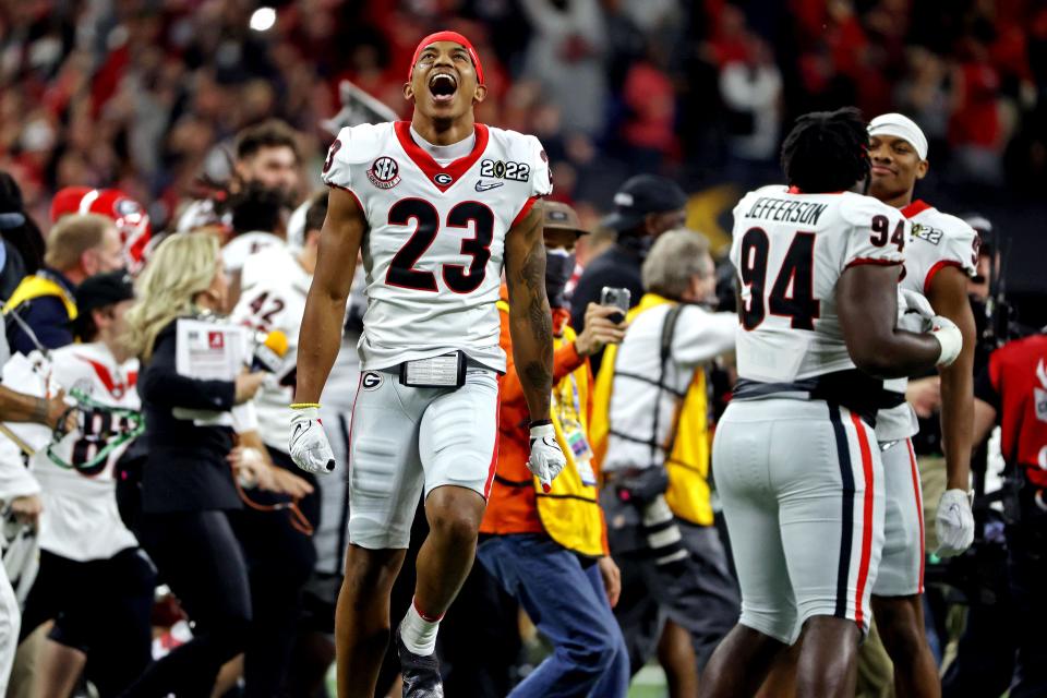 Georgia wide receiver Jaylen Johnson (23) celebrates after the  Bulldogs beat Alabama in the College Football Playoff national championship game at Lucas Oil Stadium.