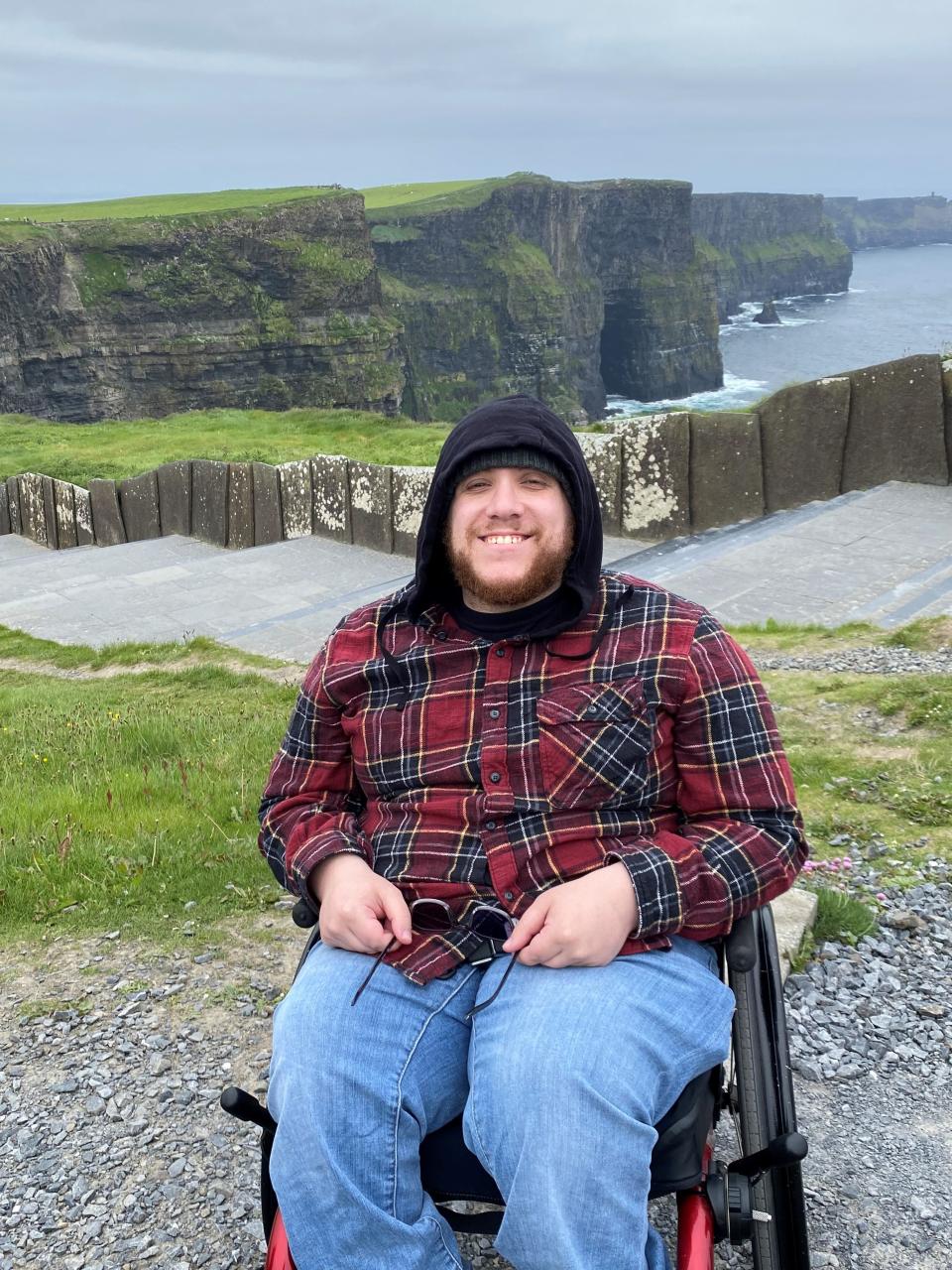 Michael Triola's wheelchair was damaged on a United Airlines flight, but his father and some airline maintenance workers were able to repair it at the airport.