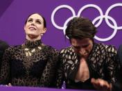 Figure Skating - Pyeongchang 2018 Winter Olympics - Ice Dance short dance competition - Gangneung Ice Arena - Gangneung, South Korea - February 19, 2018 - Tessa Virtue and Scott Moir of Canada react to their score. REUTERS/Lucy Nicholson