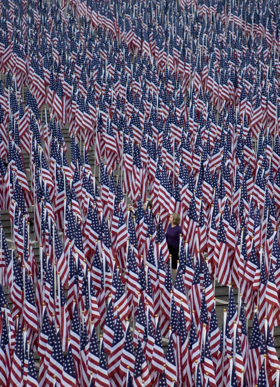 3000 flags line the Pentagon Healing Field where each flag represents a victim of the September 11 attacks, at the September 11 Pentagon Memorial Thursday, Sept. 11, 2008 at the Pentagon in Washington. (AP Photo/Evan Vucci)