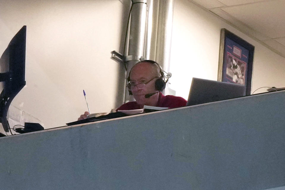 Texas Rangers broadcaster Eric Nadel watches from the press box during a baseball game between the Ranger and Miami Marlins in Arlington, Texas, Friday, Aug. 4, 2023. Hall of Fame broadcaster Nadel returned to the Rangers radio booth Friday, Aug. 4, 2023, night to call his first game of the season after he missed AL West-leading Texas' first 109 games while taking time to get treatment for some mental healthy issues. (AP Photo/LM Otero)