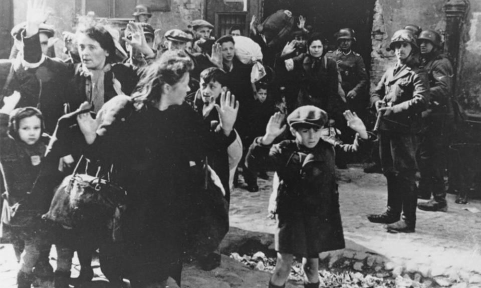 Jewish Poles surrender to German soldiers after the collapse of resistance in the Warsaw Ghetto.