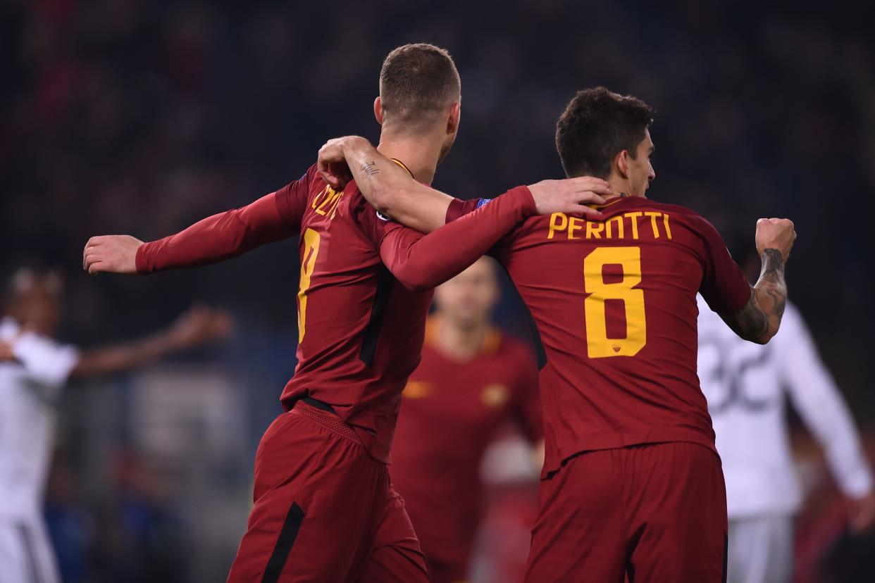 Diego Perotti and Edin Dzeko celebrate Perotti’s goal against FK Qarabag that sealed Roma’s knockout round place. (Getty)