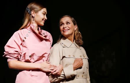 Model Gigi Hadid (L) and Lauren Hutton present creations at the Bottega Veneta fashion show during Milan Fashion Week Spring/Summer 2017 in Milan, Italy, September 24, 2016. REUTERS/Alessandro Garofalo/File Photo