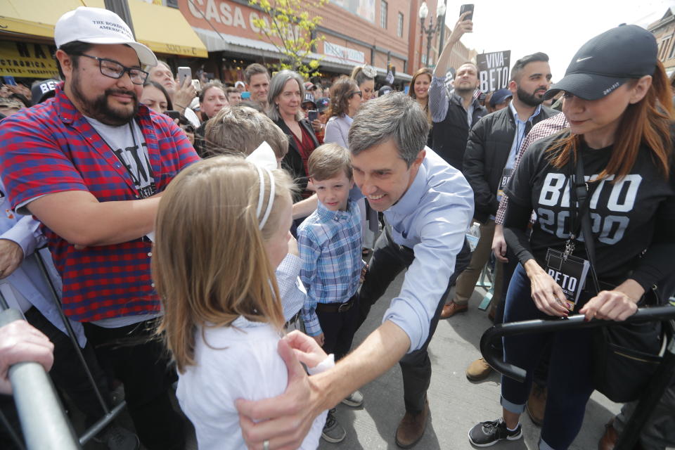 Democratic presidential candidate and former Texas congressman Beto O'Rourke, greets his daughter Molly, 10, son Ulysses, 12, and son Henry, 8, as he arrives at his presidential campaign kickoff in El Paso, Texas, Saturday, March 30, 2019. (AP Photo/Gerald Herbert)