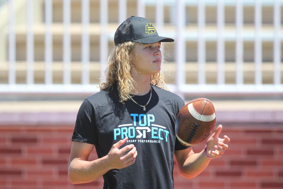 Maize quarterback Avery Johnson watches camp-goers during position-group drills at the Sharp Performance Top Prospect camp last month at Salina Stadium in Salina.