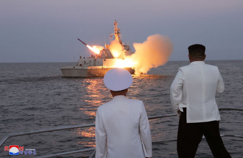 FILE PHOTO: North Korean leader Kim Jong Un oversees a strategic cruise missile test aboard a navy warship