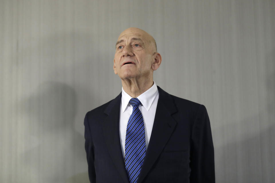 Former Israeli Prime Minister Ehud Olmert takes questions from reporters after a news conference in New York, Tuesday, Feb. 11, 2020. (AP Photo/Seth Wenig)