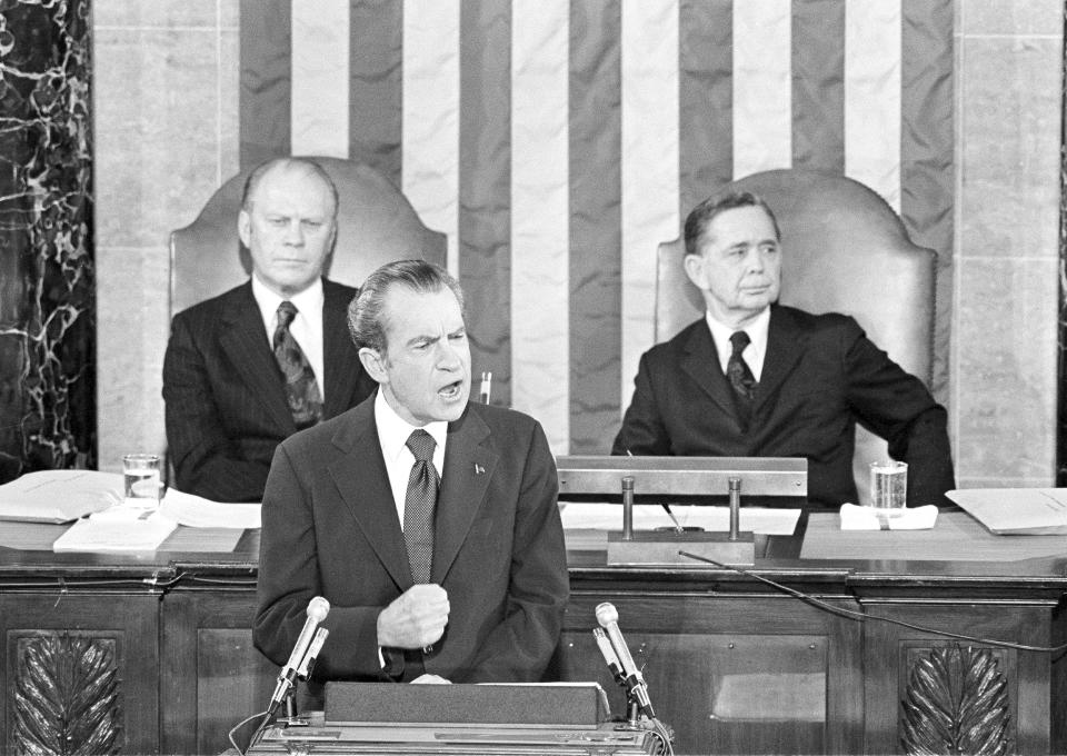 FILE - In this Jan. 30, 1974, file photo Vice President Gerald Ford and House Speaker Carl Albert listen to President Richard Nixon deliver his State of the Union address to a joint session of Congress in Washington. President Donald Trump will deliver his State of the Union address at one of the most contentious times in his stewardship of the nation, but others may have had it worse: Abraham Lincoln had the Civil War, Nixon was caught up in Watergate and Bill Clinton was impeached. (AP Photo)