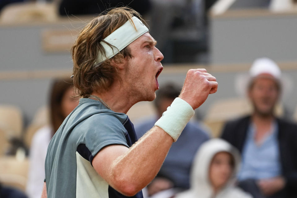 Russia's Andrey Rublev clenches his fist after winning the fourth set against Croatia's Marin Cilic during their quarterfinal match at the French Open tennis tournament in Roland Garros stadium in Paris, France, Wednesday, June 1, 2022. (AP Photo/Michel Euler)