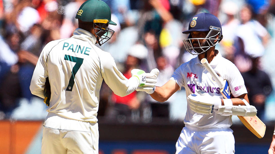 India's captain Ajinkya Rahane (pictured right) bumps fists with Australia's captain Tim Paine (pictured left).