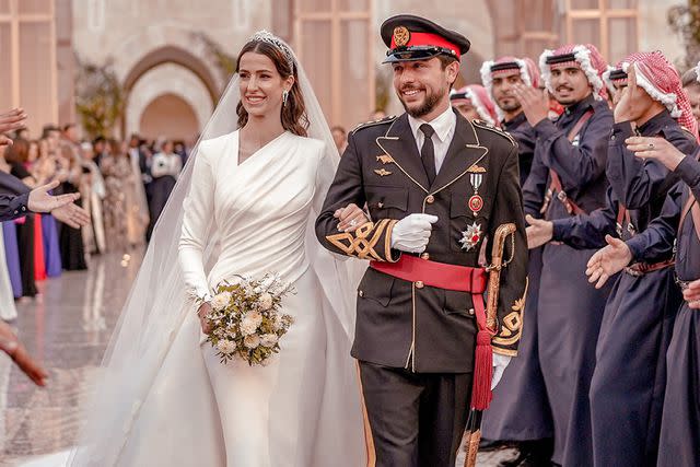 <p>Jordan Pix/Getty Images</p> Princess Rajwa and Crown Prince Hussein at their wedding