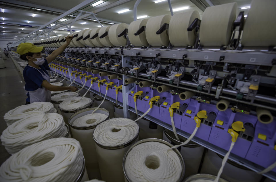 YULI, CHINA - SEPTEMBER 25: An employee works at a textile factory on September 25, 2020 in Yuli County, Xinjiang Uygur Autonomous Region of China. (Photo by VCG/VCG via Getty Images)