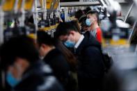 People wearing face masks are seen on a subway following an outbreak of the coronavirus disease (COVID-19) in Shanghai