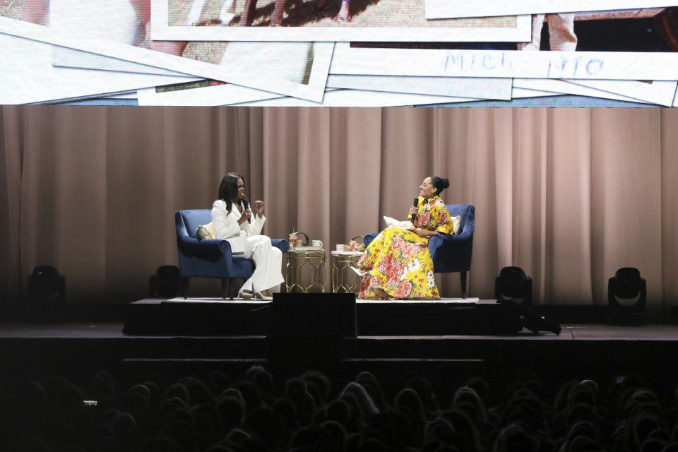 Former first lady Michelle Obama, left, and Tracee Ellis Ross speak at the "Becoming: An Intimate Conversation with Michelle Obama" event at the Forum on Thursday, Nov. 15, 2018, in Inglewood, Calif. (Photo by Willy Sanjuan/Invision/AP)