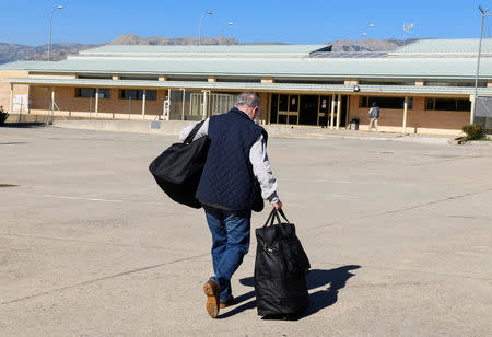 Former International Monetary Fund chief Rodrigo Rato walks towards the entrance to the prison to begin his sentence in Soto del Real, Spain, October 25, 2018. REUTERS/Stringer