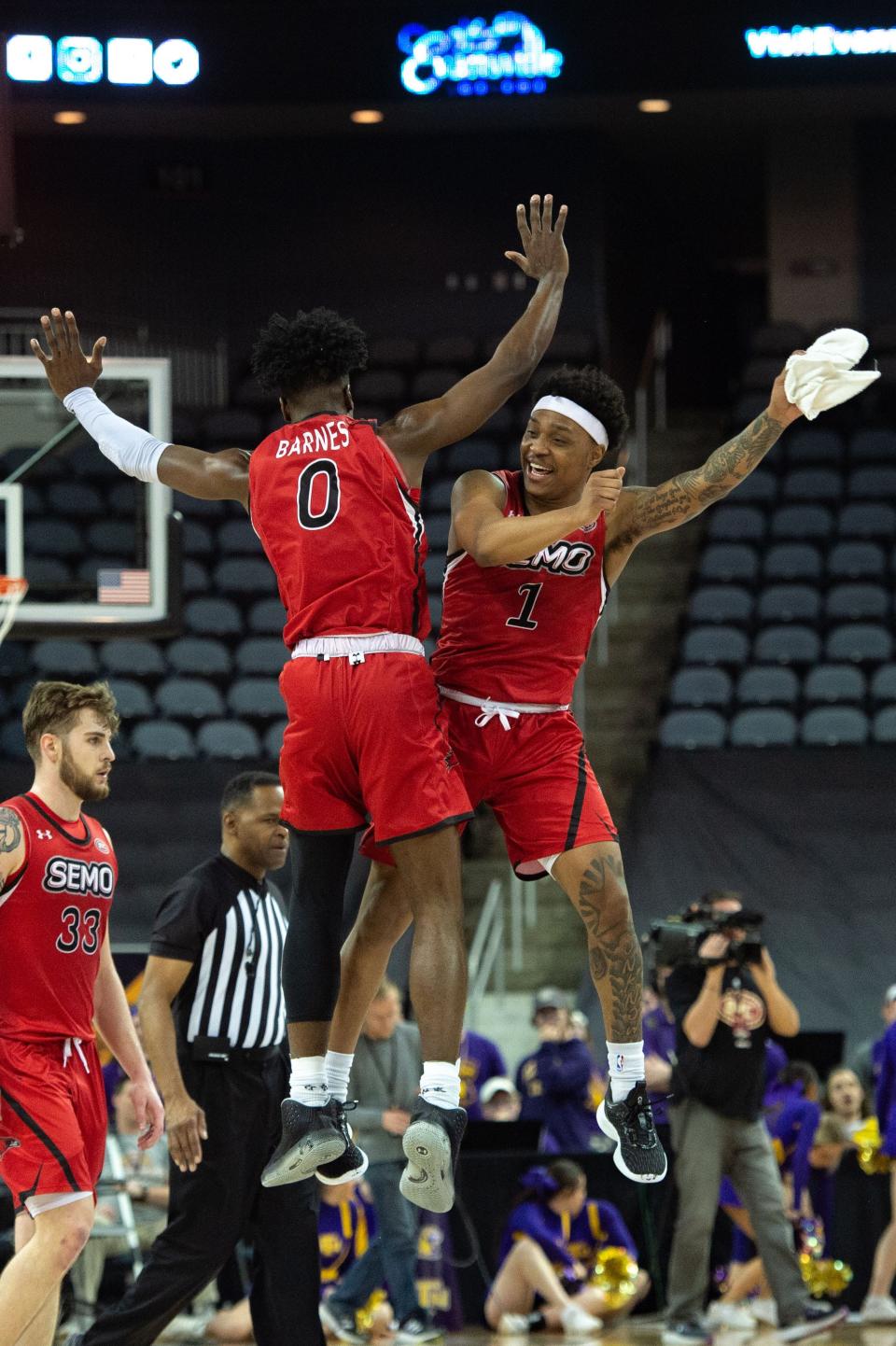 Southeast Missouri’s Israel Barnes (0) and Phillip Russell (1) jump and celebrate an advantage in the second half during their game against the Tennessee Tech Golden Eagles for the OVC men's basketball championship at Ford Center on Saturday, March 4, 2023.