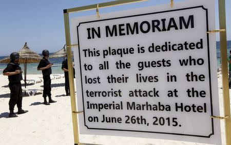 A plaque dedicated to those killed in a recent attack by an Islamist gunman, is seen at the beach where the attack took place during a minute's silence in Sousse, Tunisia July 3, 2015. REUTERS/Anis Mili