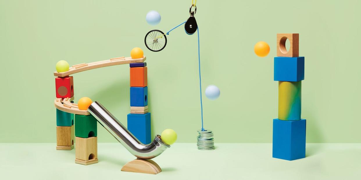 toys assembled to create a motion machine on a green background