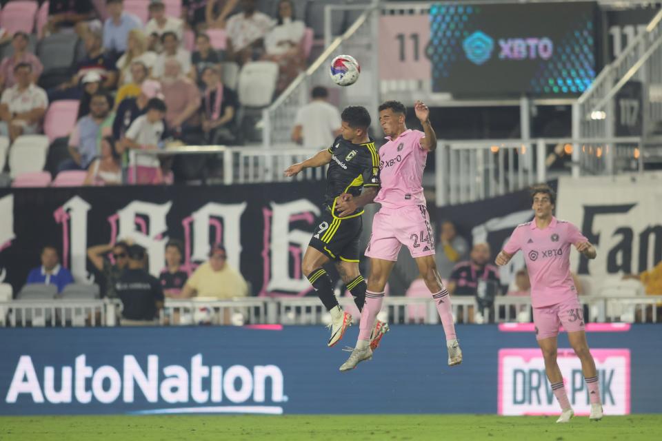 Jul 4, 2023; Fort Lauderdale, Florida, USA; Columbus Crew SC forward Cucho Hernandez (9) and Inter Miami defender Ian Fray (24) jump for a header during the second half at DRV PNK Stadium. Mandatory Credit: Sam Navarro-USA TODAY Sports