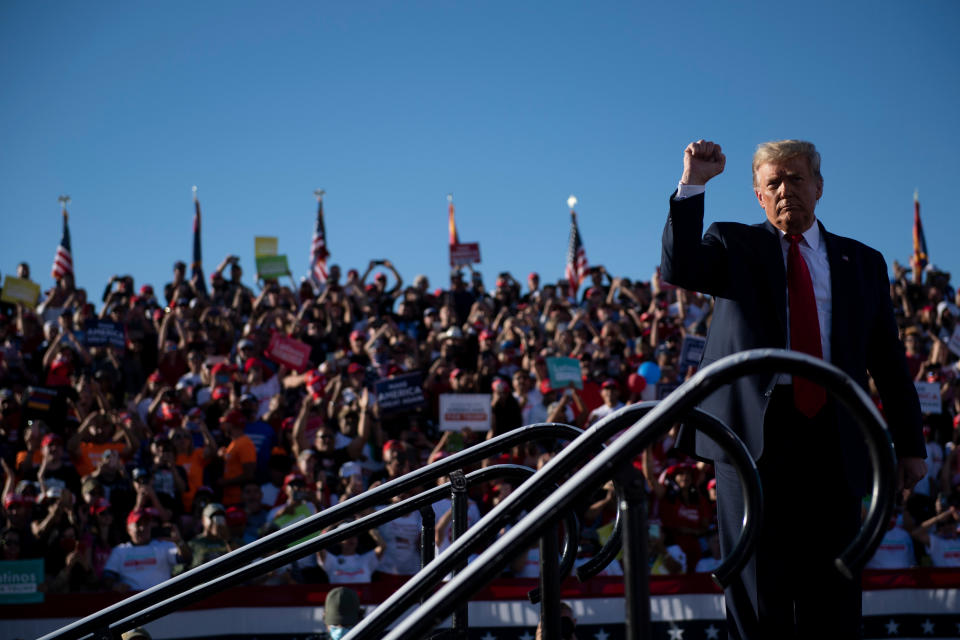 US President Donald Trump holds up his fist as he leaves after speaking during a Make America Great Again rally at Phoenix Goodyear Airport October 28, 2020, in Goodyear, Arizona. (Photo by Brendan Smialowski / AFP) (Photo by BRENDAN SMIALOWSKI/AFP via Getty Images)