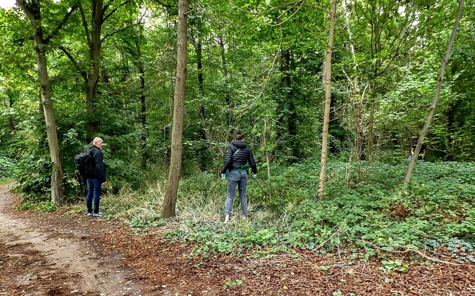 Police officers in the Bois de Boulogne following the discovery of the body of teenager Philippine