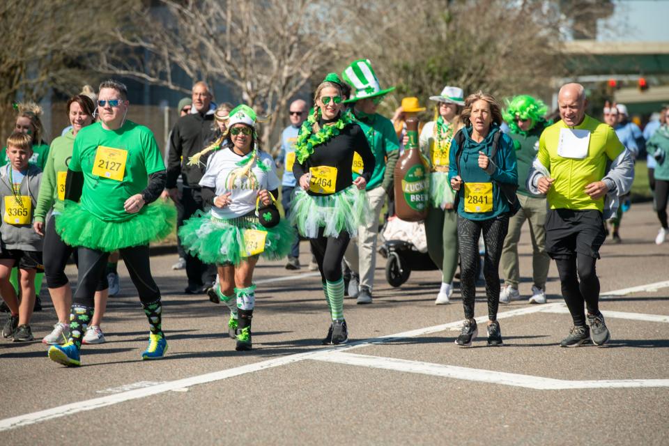 Runners participate in the 45th annual McGuire's St. Patrick's Day Prediction 5K Run Saturday, March 12, 2022 in downtown Pensacola.