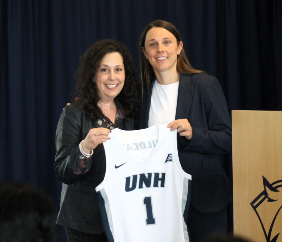 University of New Hampshire Director of Athletics Allison Rich, left, formally introduced Megan Shoniker as the new women's basketball coach on Thursday.