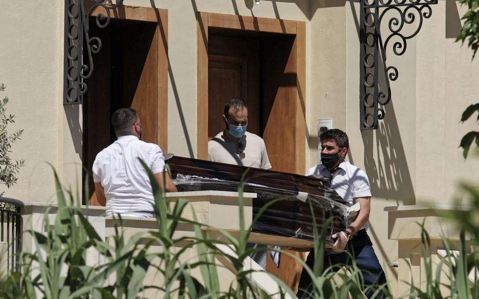 A coffin is taken out of the house where Caroline Crouch was murdered in Glyka Nera in the outskirts of Athens - John Liakos/Intime News/Athena Pictures /Athena Picture Agency Ltd 